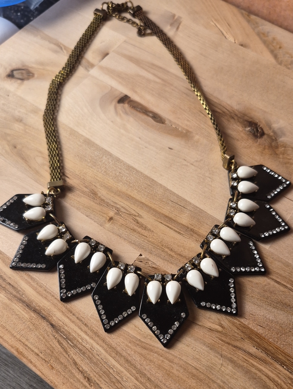 Gold-Tone Necklace with Black Panels and Cream Teardrop Accents